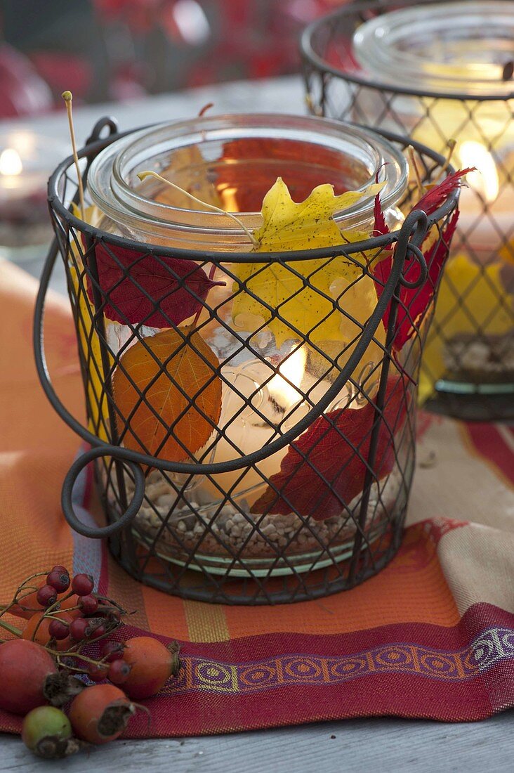 Preserving jars in wire baskets as lanterns