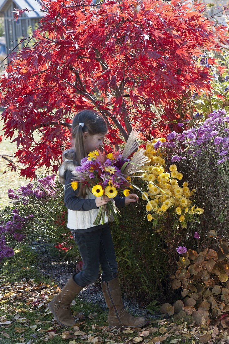 Girl with autumn bouquet