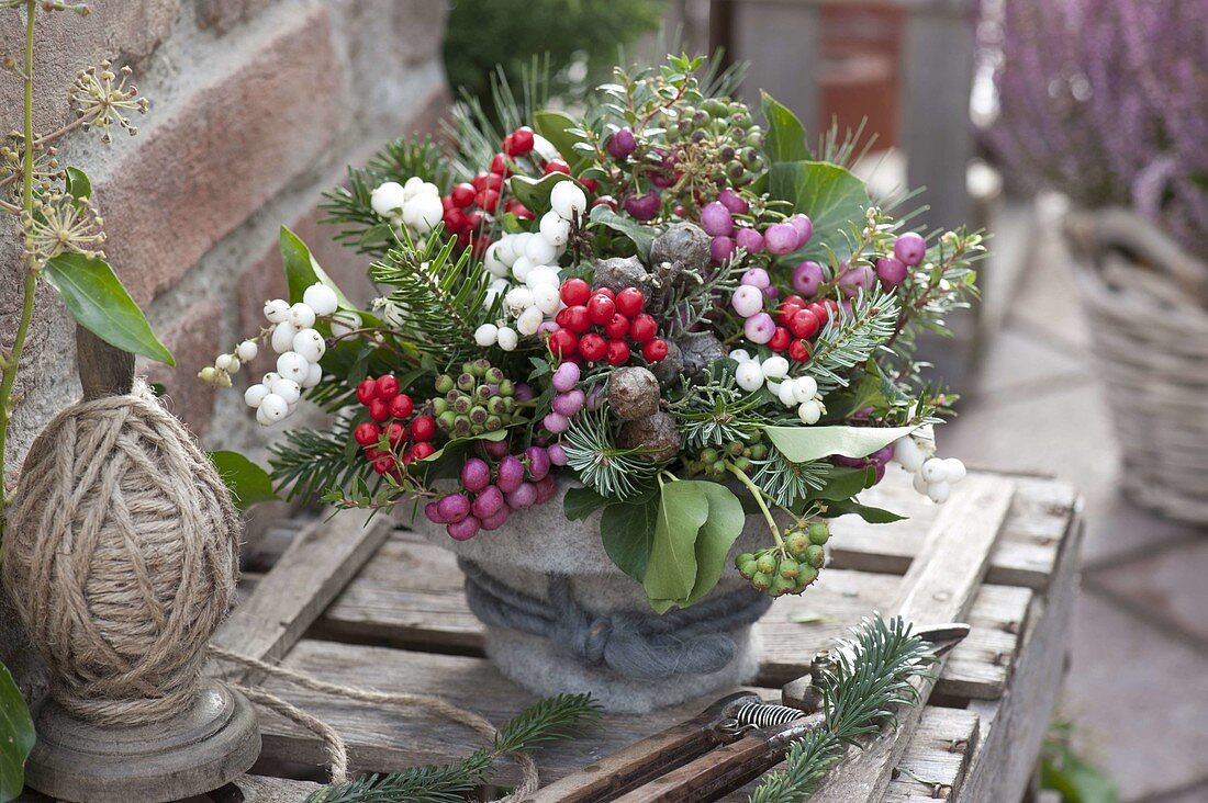 Autumnal berry bouquet with coniferous branches