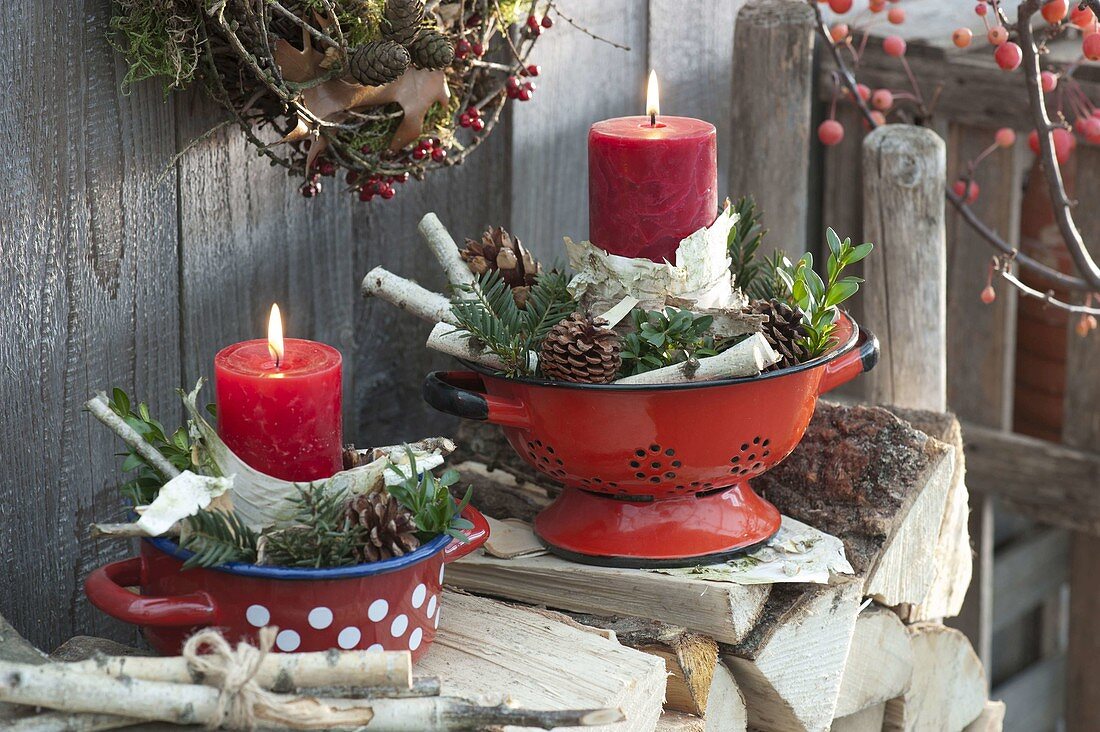Red candles with betula bark and twigs, pinus cones