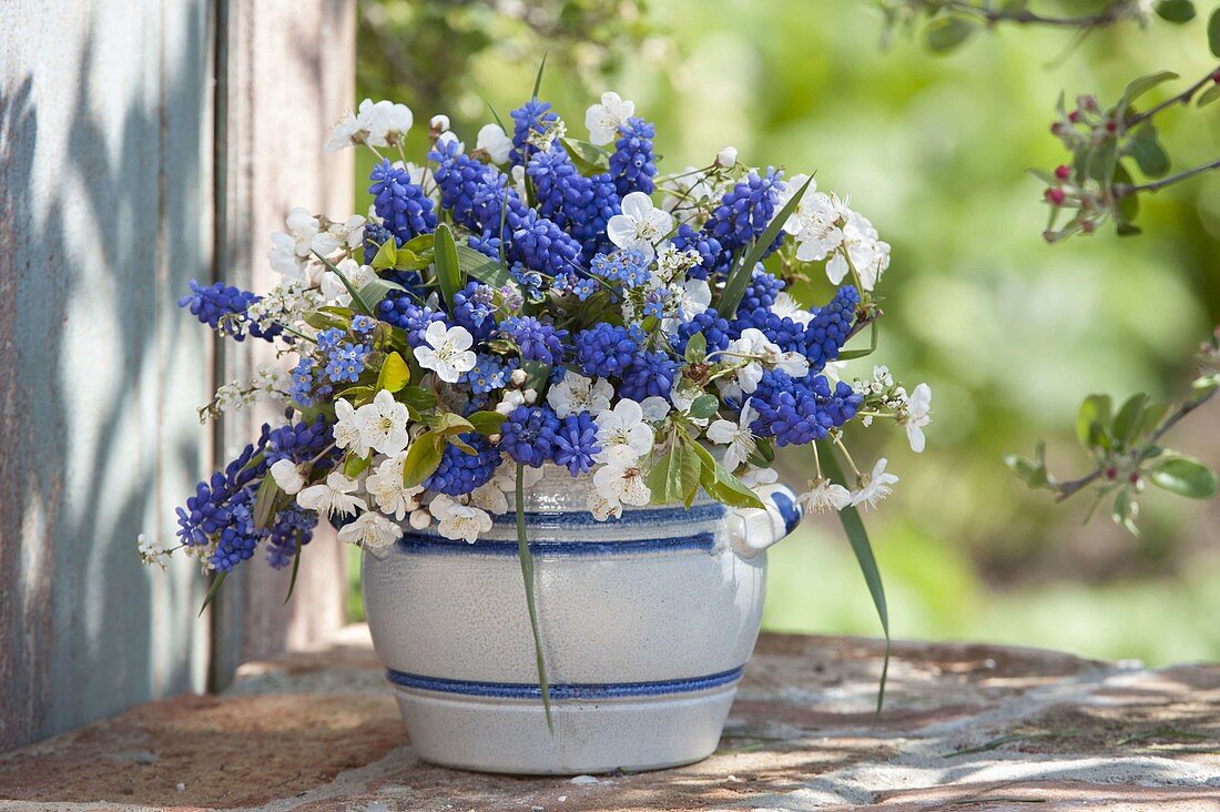 Blue-white spring bouquet in salt glazed pot