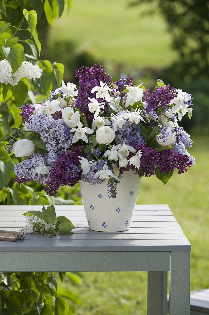 Woman puting fragrant spring bouquet