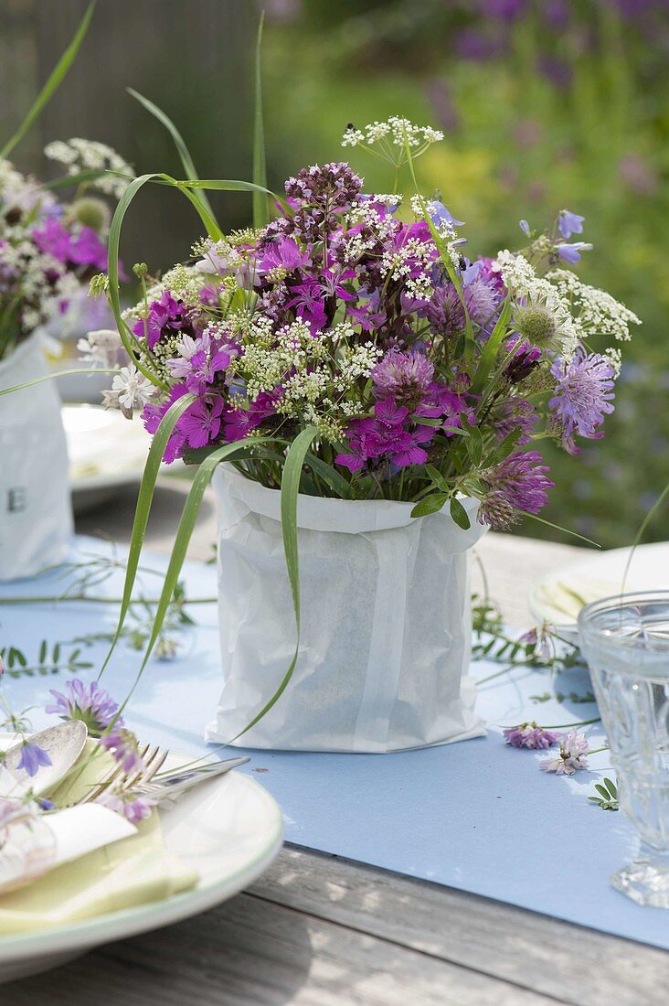 Summer table decoration with meadow flowers