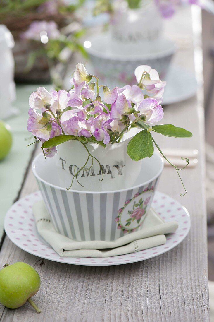 Romantic table decoration with perennial peas