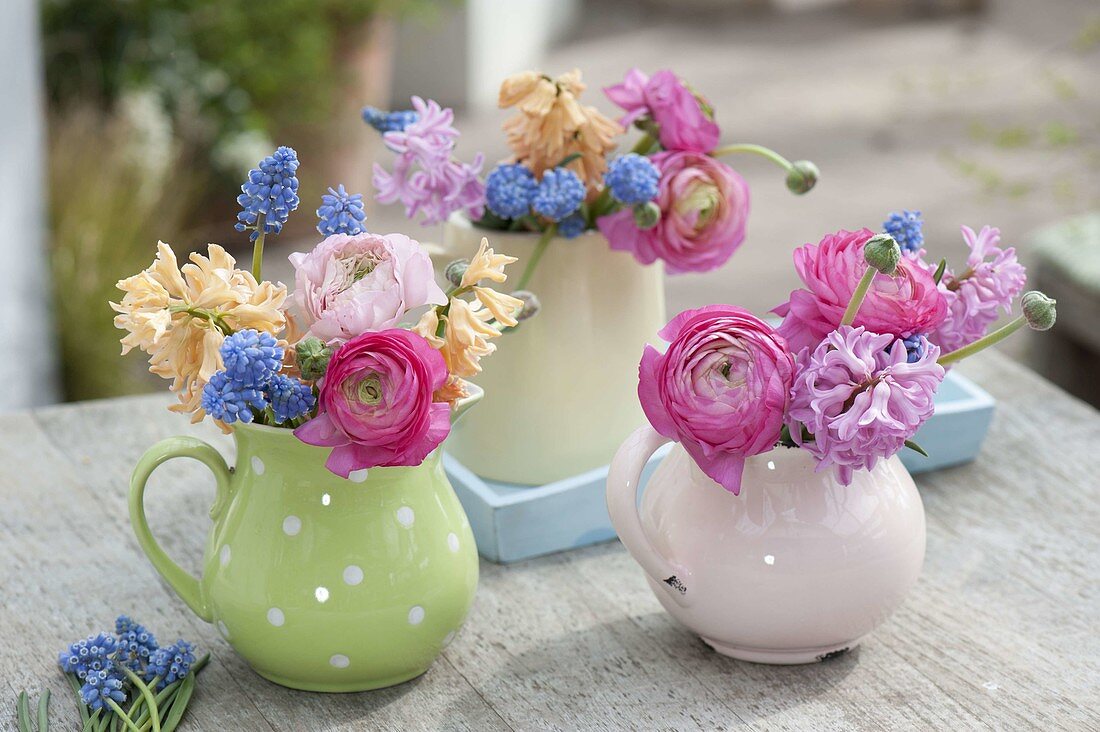 Small spring bouquets in cream jug