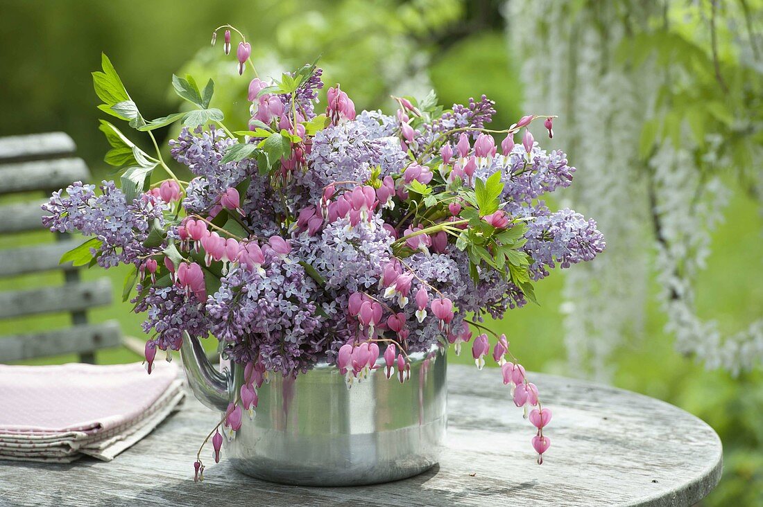Scented bouquet in an old kettle: Syringa (lilac) and Dicentra