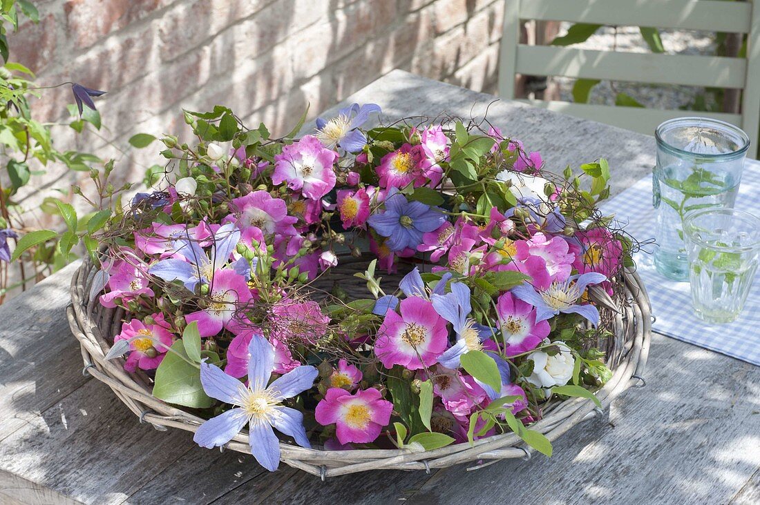 Wide basket bowl with roses wreath, Clematis 'Perle D'Azur'