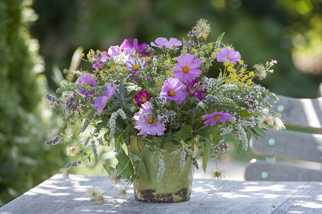 Bouquet of summer flowers and flowering herbs