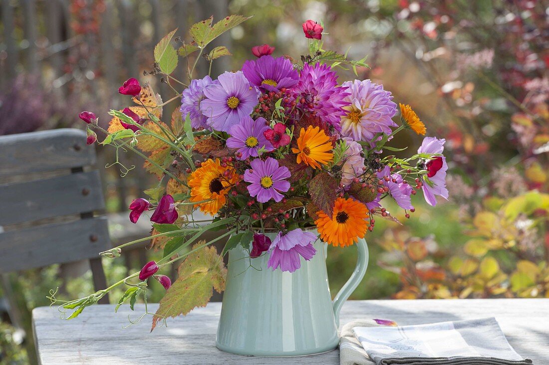 Bouquet of the last summer flowers: Calendula (marigolds), Cosmos