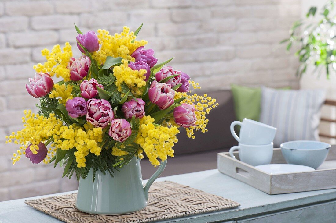 Fragrant blooming Tulipa and Acacia bouquet