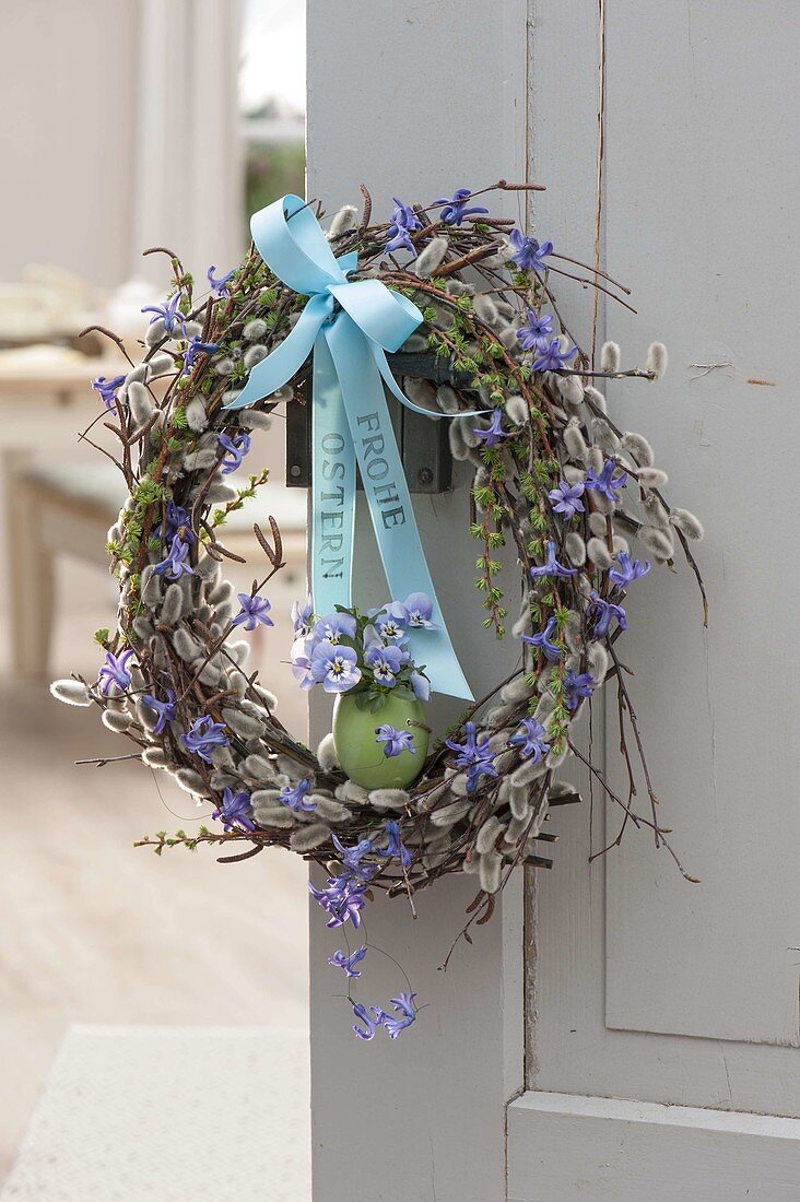 Elegant Easter wreath from branches of Salix, Betula