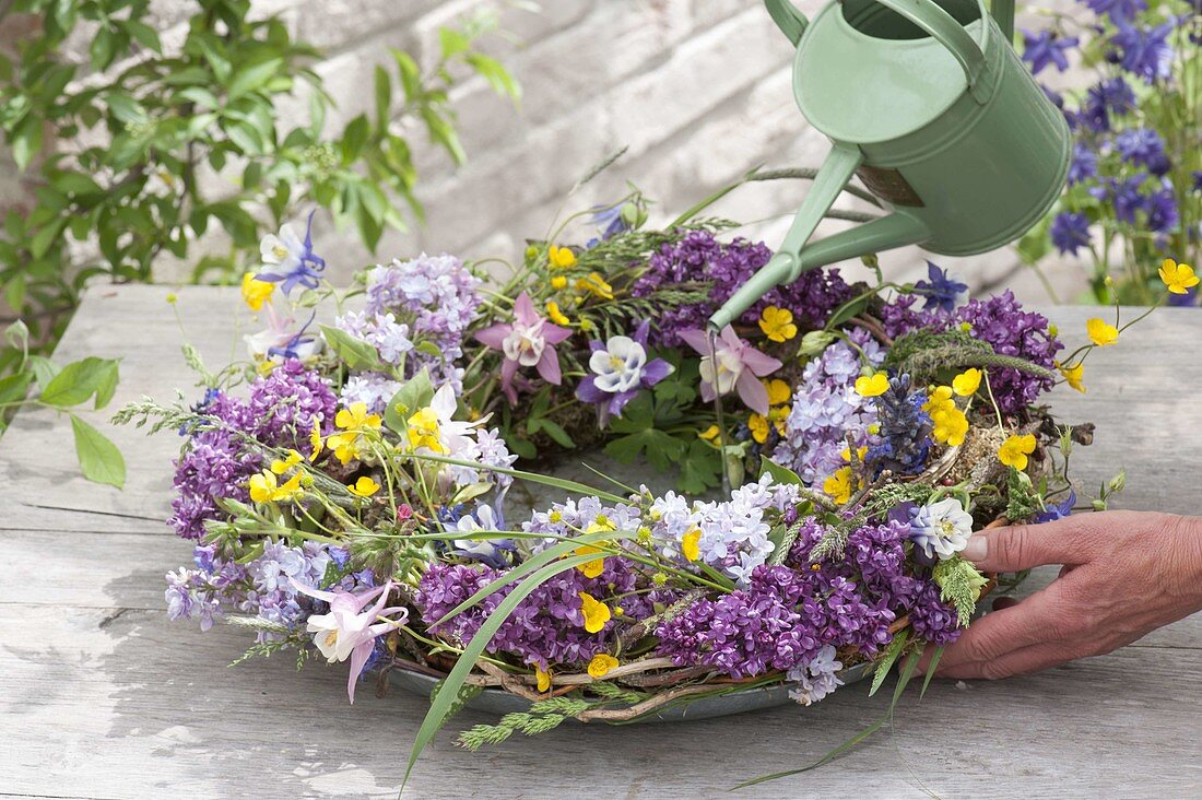 Colorful mixed wreath, with Syringa, Pulmonaria