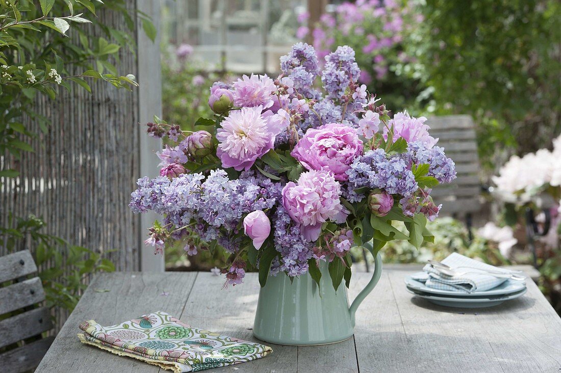 Fragrant bouquet of Paeonia and Syringa