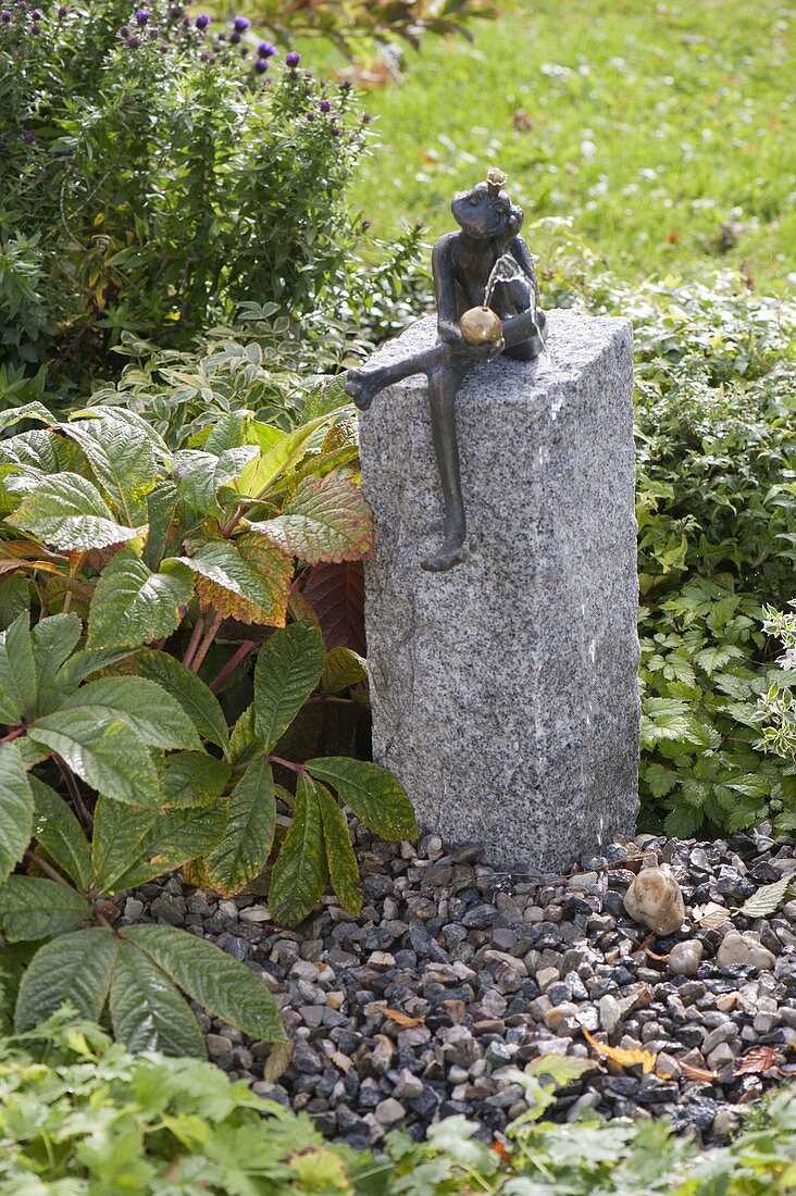 Build up water game with frog on granite pillar