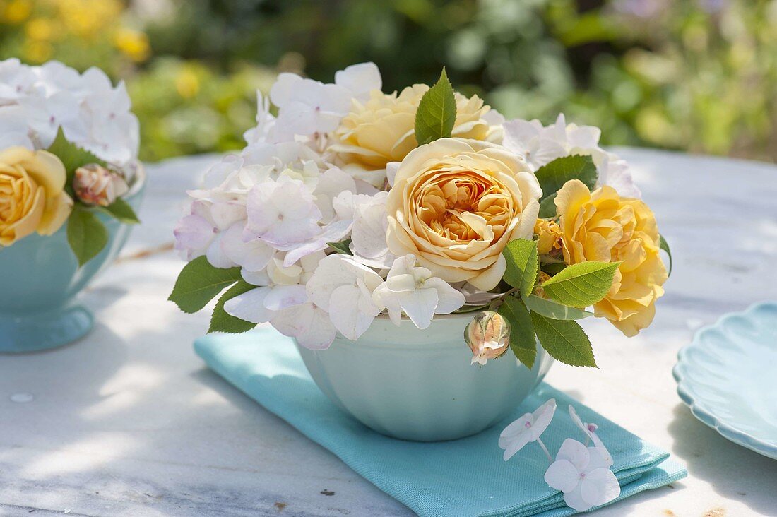 Small yellow-white posy of pink (rose) and hydrangea