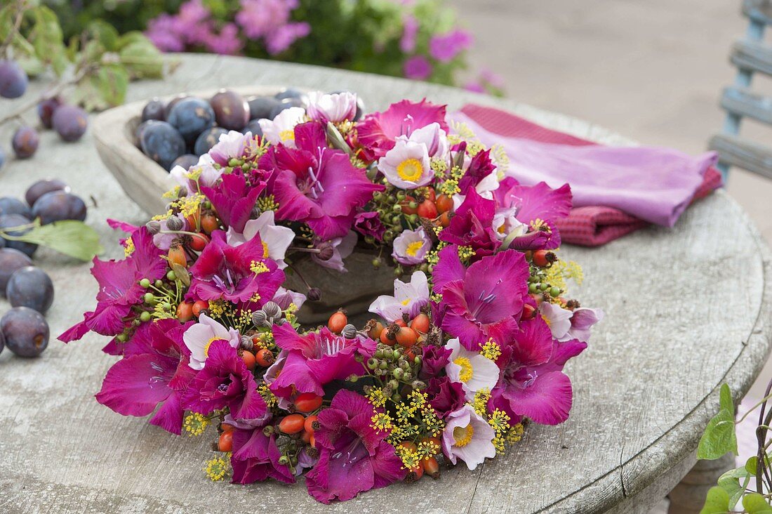 Muted wreath with flowers of Gladiolus, Anemone hupehensis