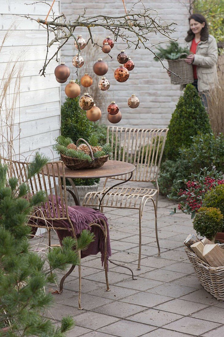 Christmas terrace with copper balls on the branch