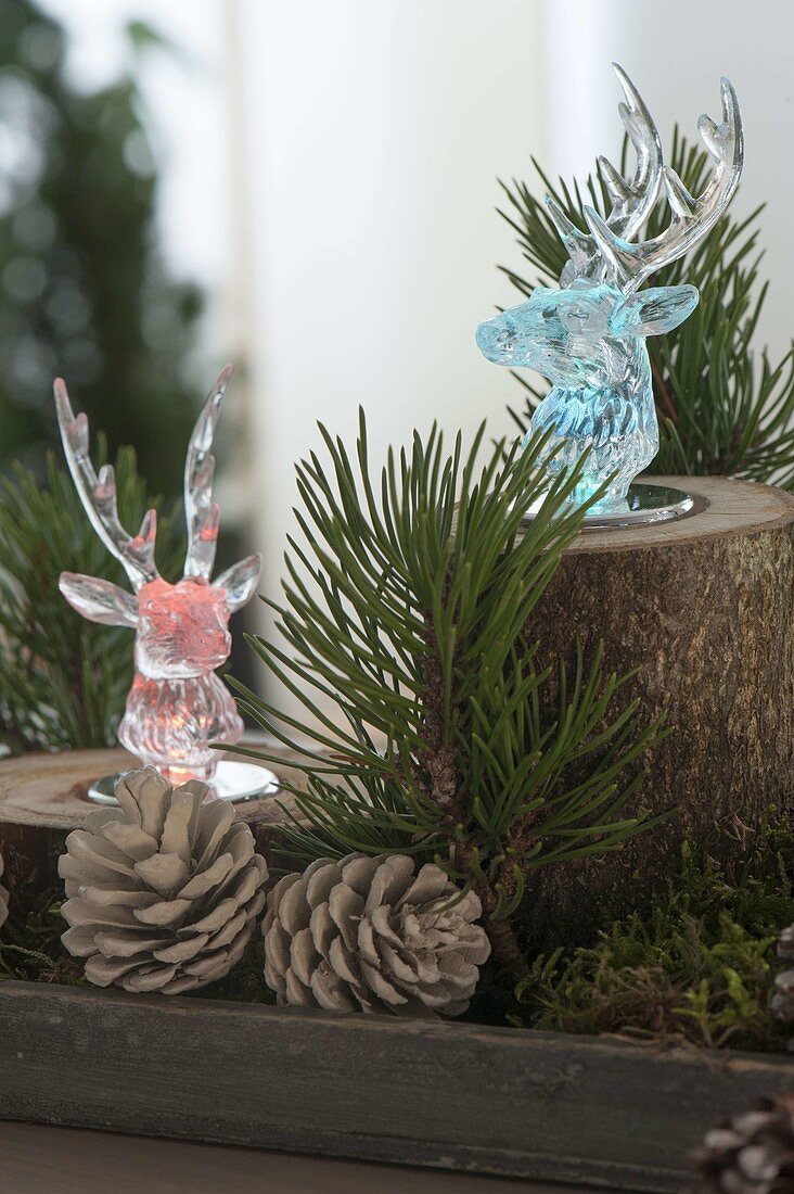 Christmas forest decoration with colored LED light deer