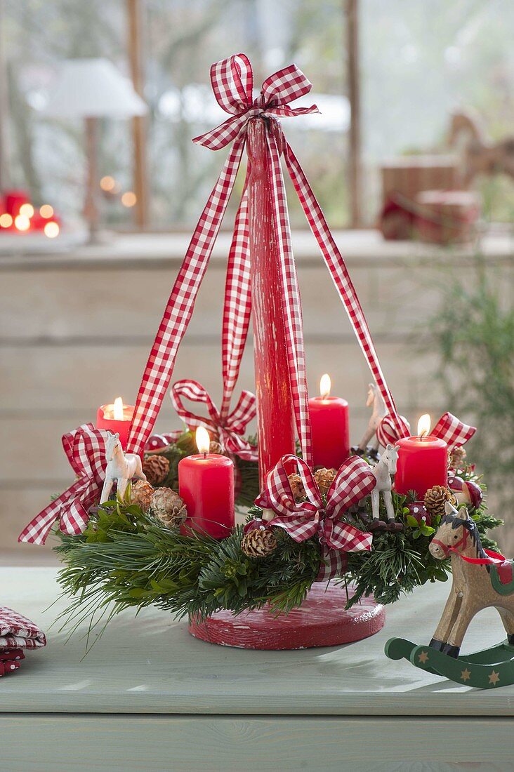 Hanging Christmas wreath on wooden stand