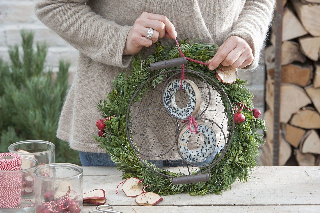 Mixed wreath as feed station for birds