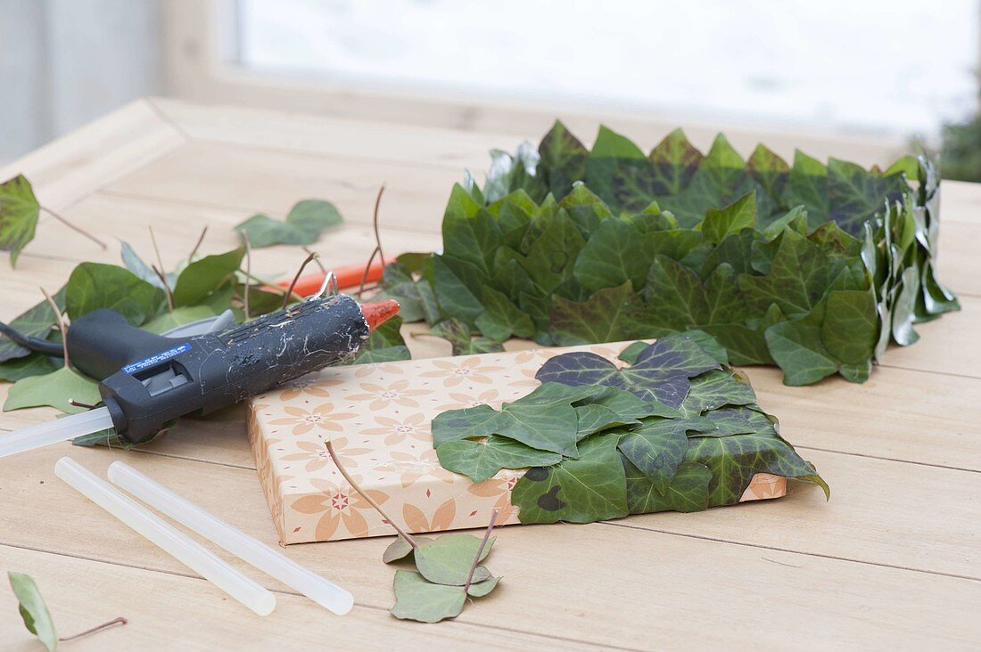 Gift box stuck with ivy leaves