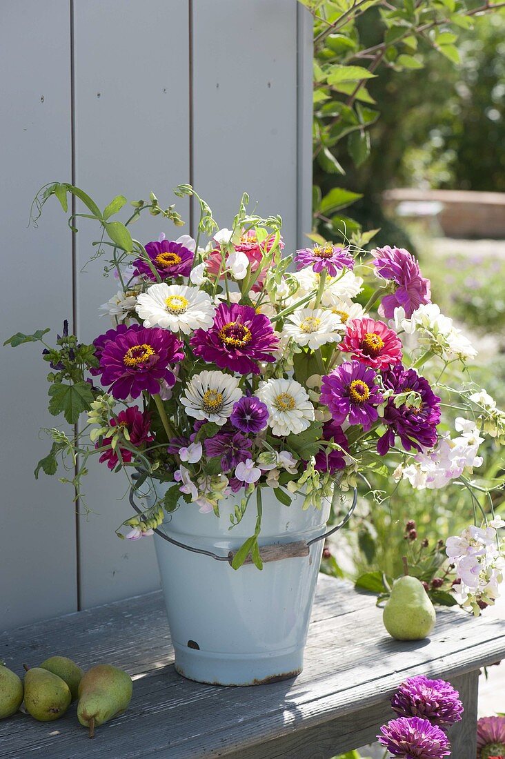 Rural late summer bouquet in enameled bucket