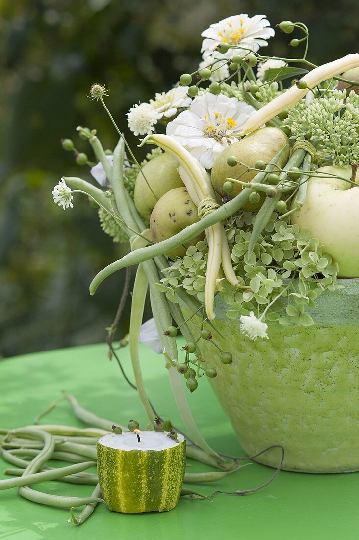 White-green bouquet with summer flowers, fruits and vegetables