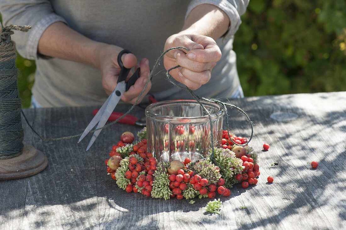 Wreath made of rowan berries, ornamental apples and stonecrop