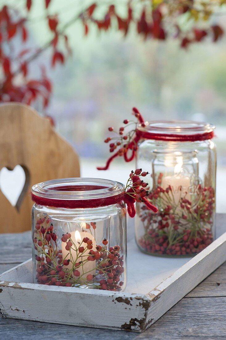 Preserving jars as glass in glass. Wind lights with pink