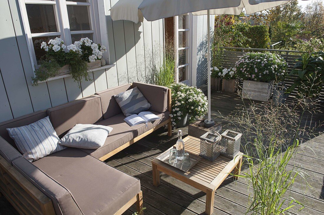 Summer deck with lounge corner and parasol