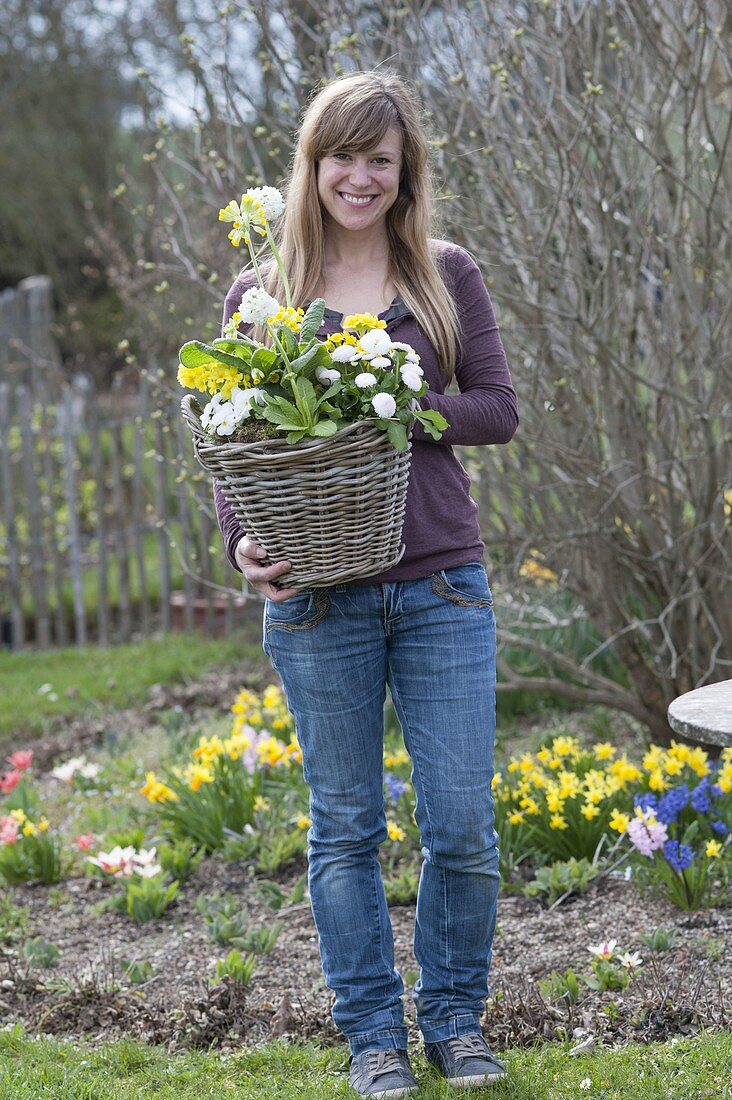 Woman with yellow-white planted basket