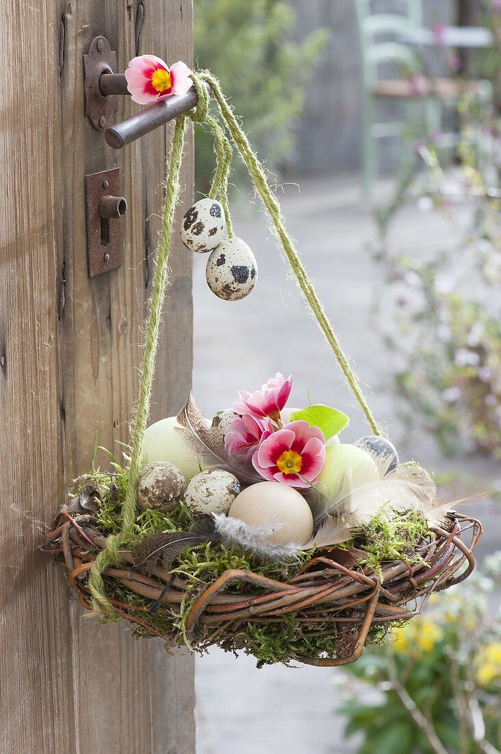 Easter nest of twigs and moss, filled with Easter eggs