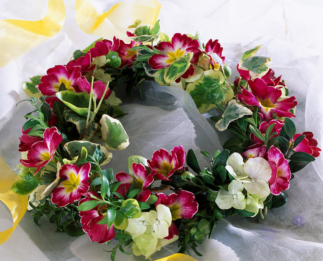 Primrose flowers, hydrangeas and ivy wreath