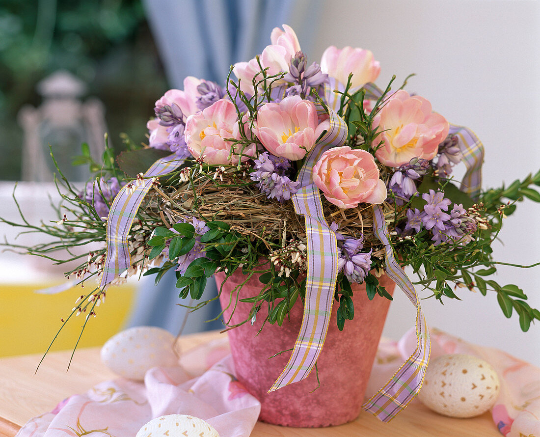 Bouquet tied with wreath of hay, Tulipa 'Apple Blossom'