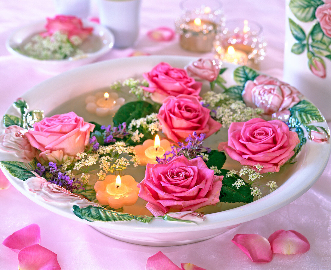 Bowl with rose motif and rose petals floating in the water