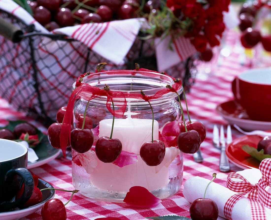 Preserving jar as lantern with prunus (sweet cherries)