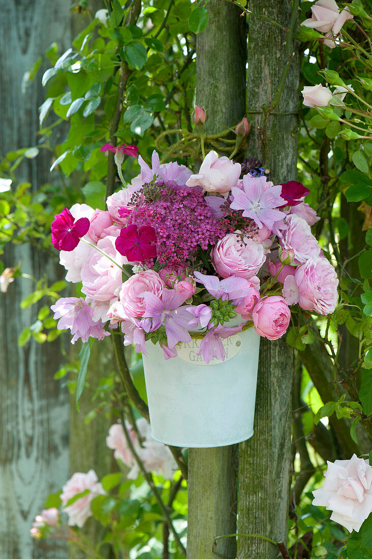 Romantic bouquet made of roses, malva (mallow)