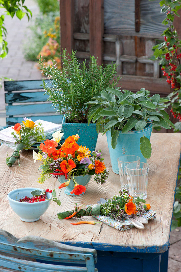 Table decoration with herbs and edible flowers
