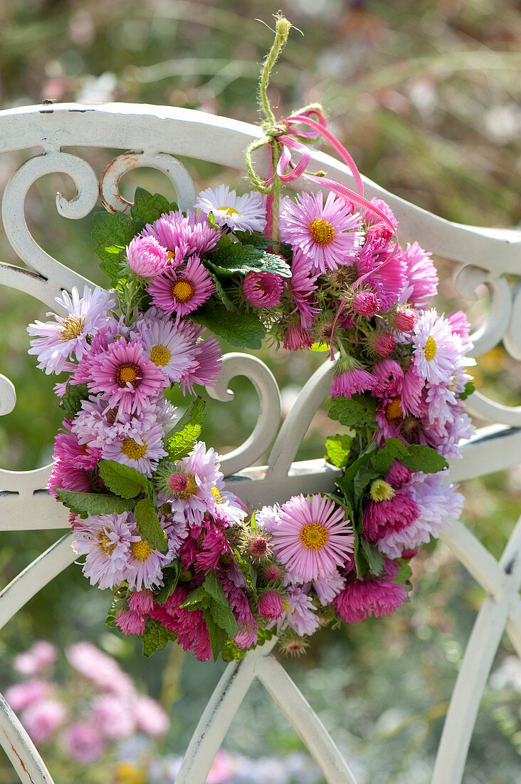 Small wreath from Aster hanged from bench back