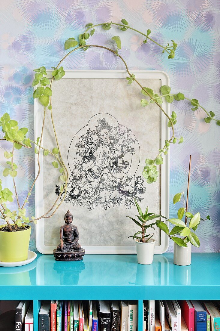 Plant climbing around picture of Oriental god