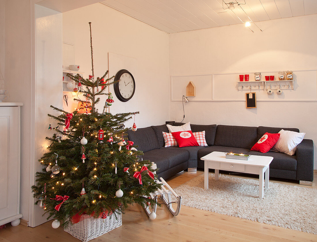 Decorated Christmas tree in modern apartment
