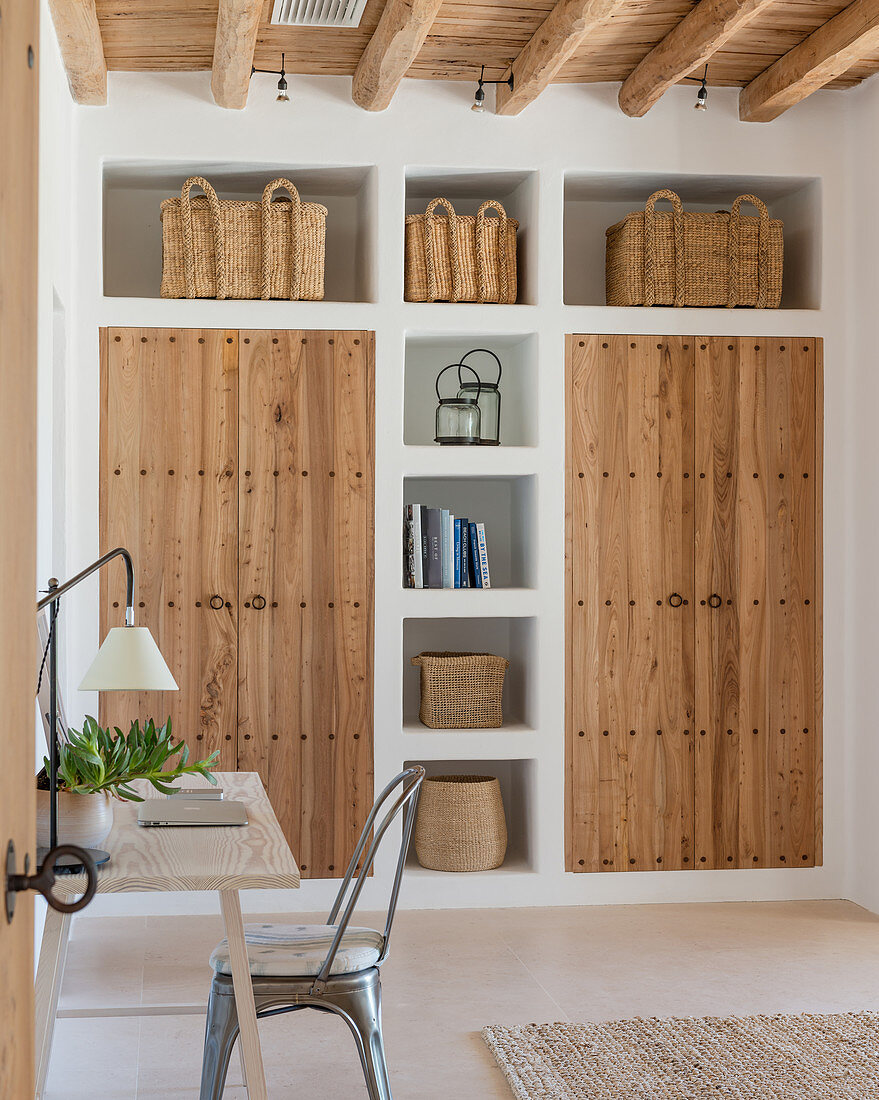 Masonry cupboards and shelves with wooden doors and baskets