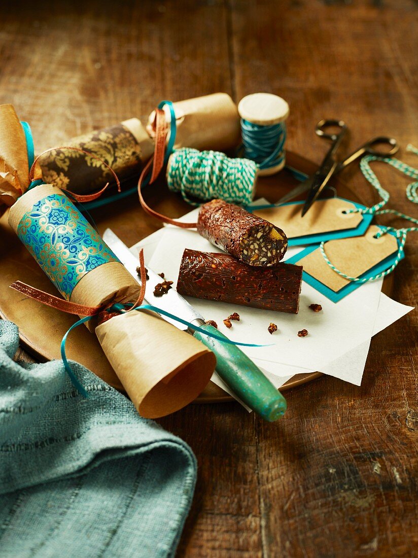 Chocolate and dried fruit rolls in Christmas cracker wrappings