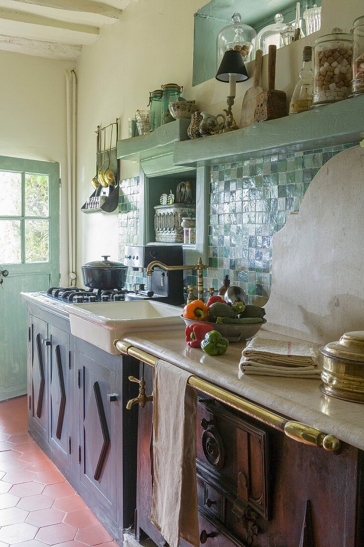 Vintage-style country-house kitchen with turquoise wall tiles