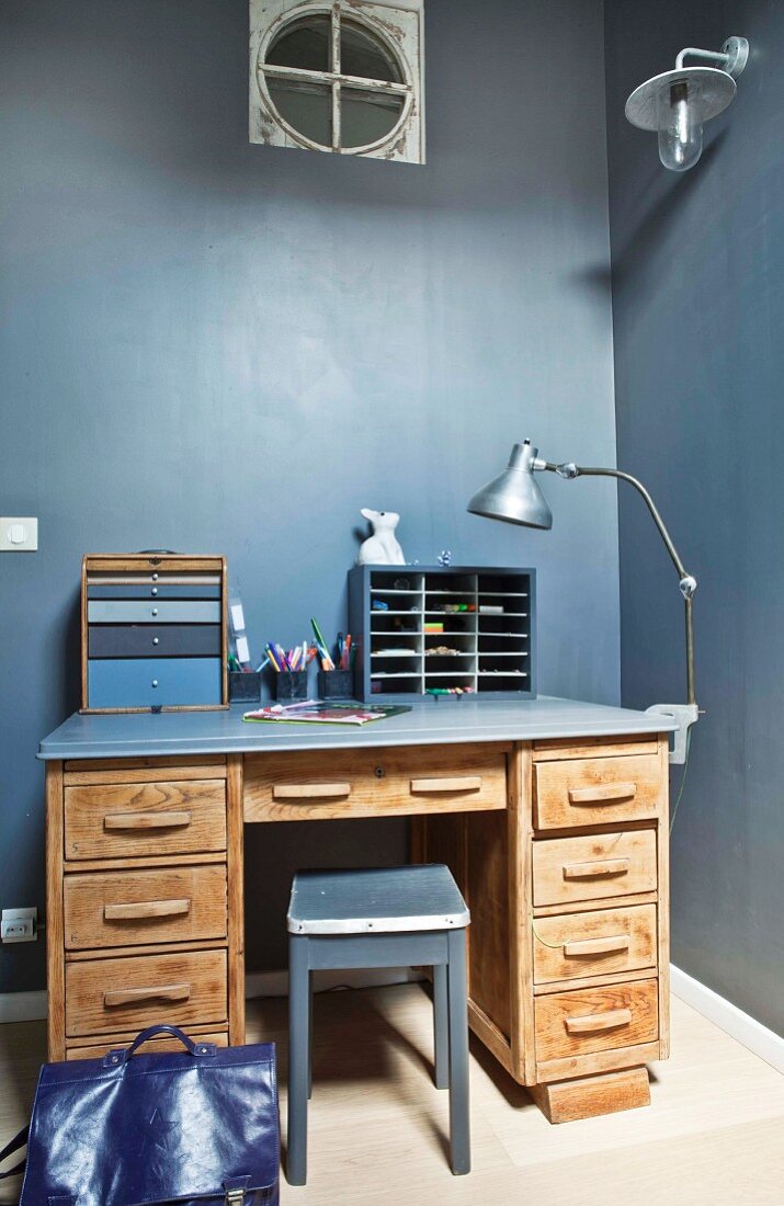 Desk against grey-blue wall