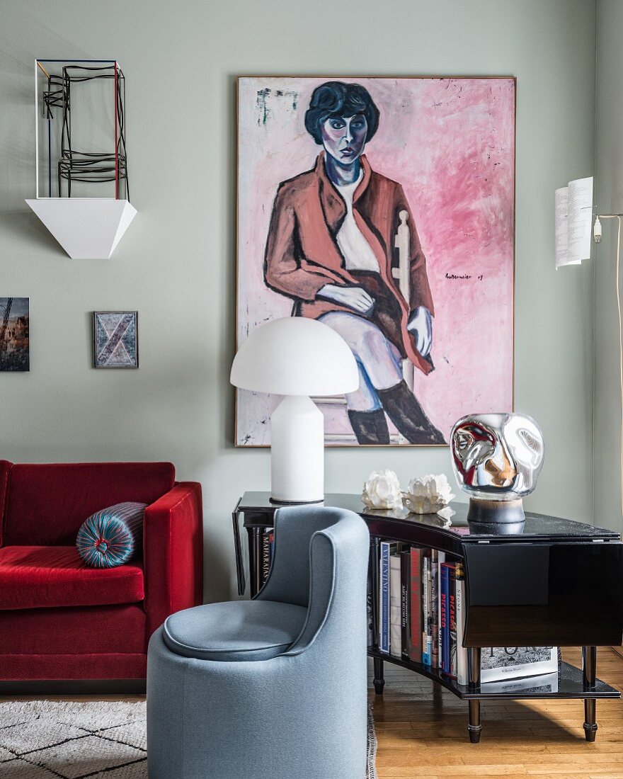 Portrait of woman and stylish mixture of furniture in living room