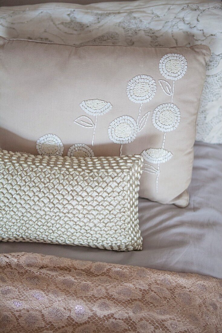 Various cushions and textiles in Champagne hues