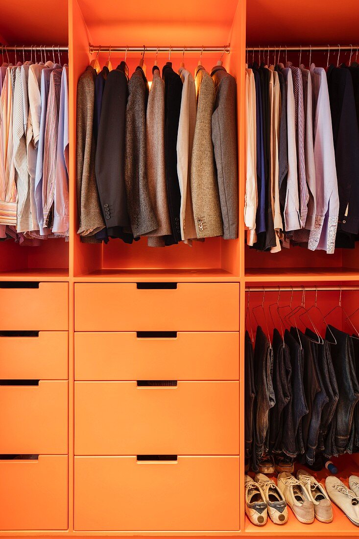 Men's clothing in fitted wardrobe with drawers