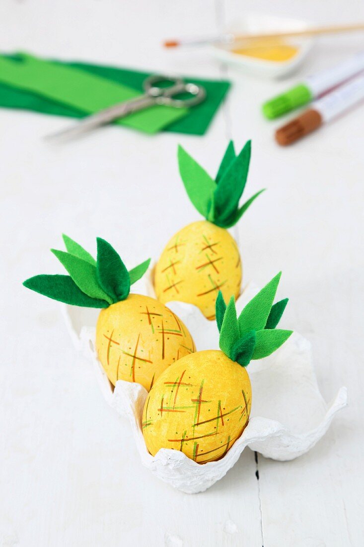 Pineapple ornaments made from blown eggs