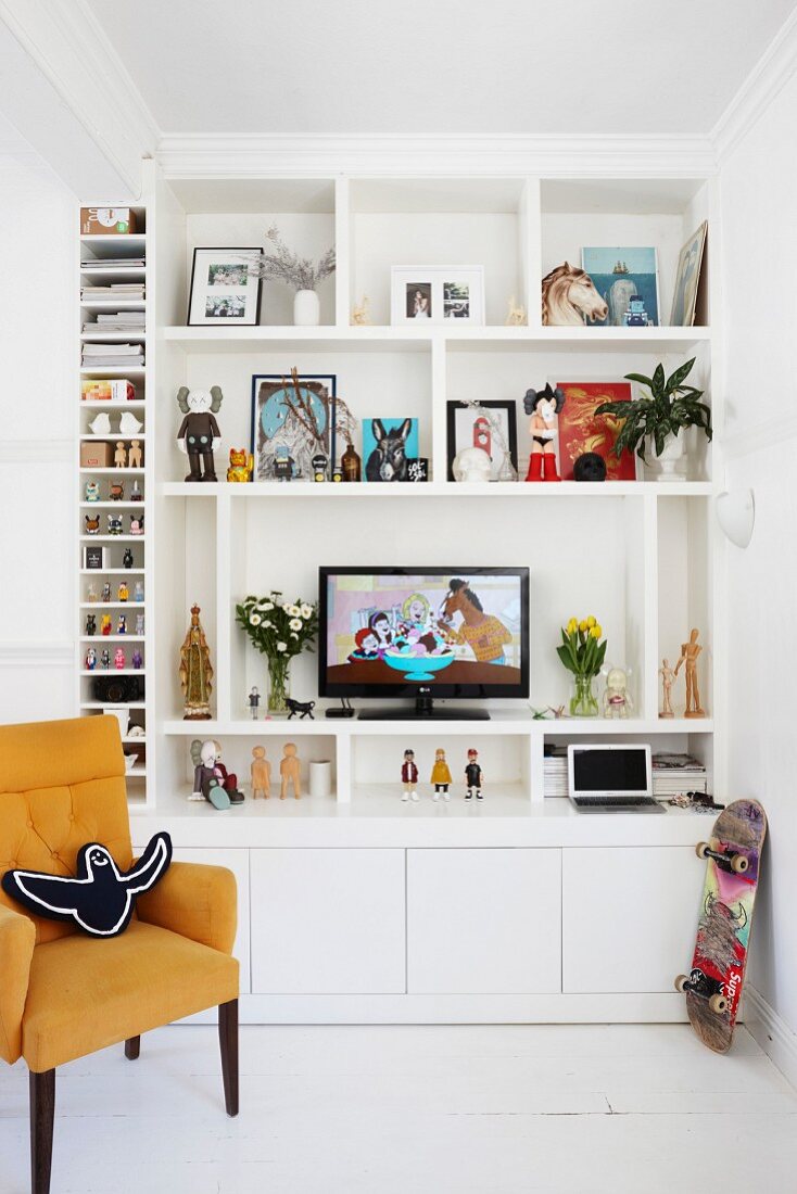 TV on white open-fronted shelves